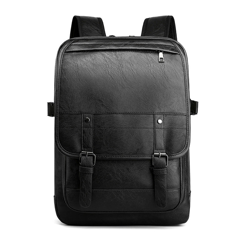 Black retro-style leather backpack with buckled straps, top zipper, and padded shoulder straps on a white background.