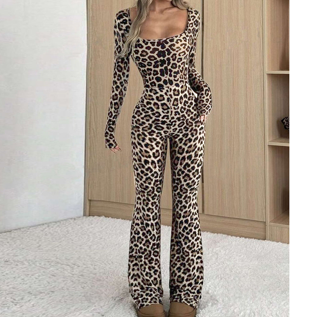 Women’s slim-fit leopard print jumpsuit featuring a square neckline, long sleeves, and fitted, flared-leg silhouette.