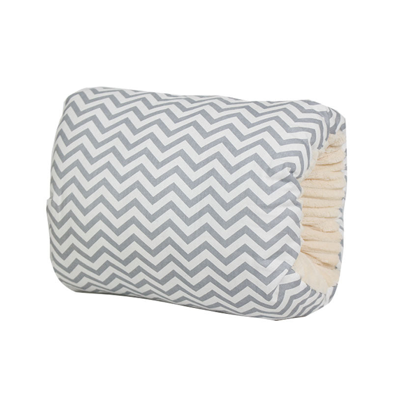 Grey and white chevron cotton nursing arm pillow with a soft, cream-colored fleece interior lining.