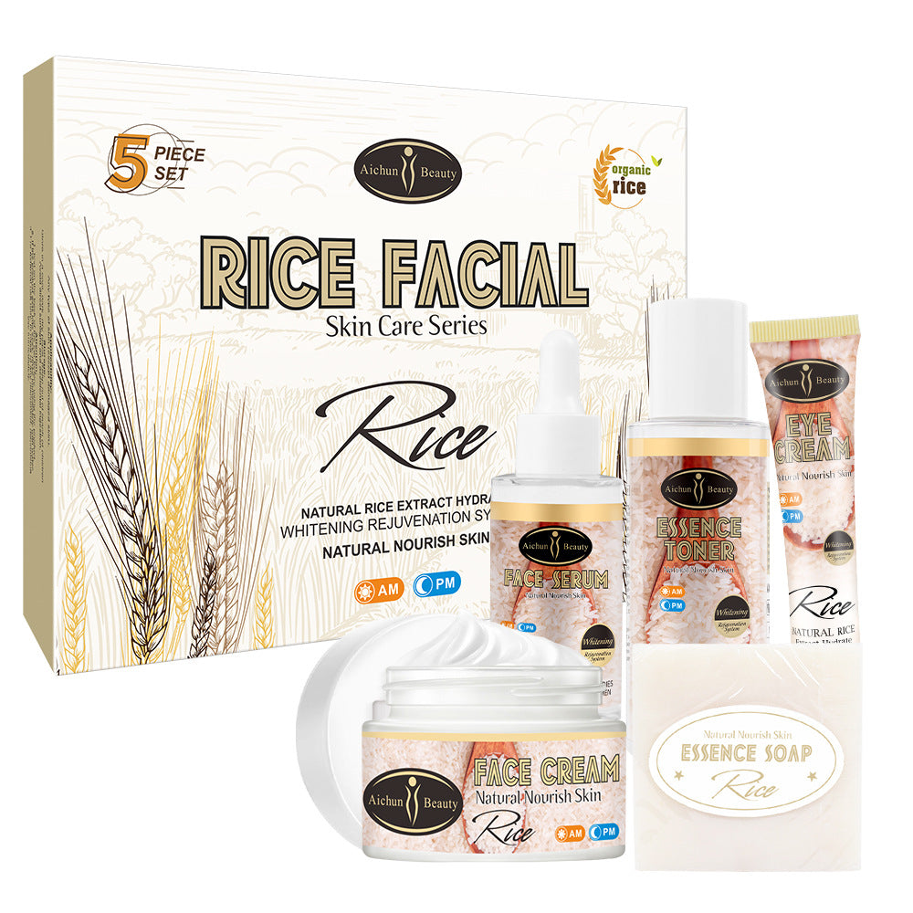 Aichun 5-piece rice skin care set in a beige box. Includes face cream, serum, toner, eye cream, and soap.