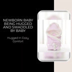 Newborn baby being hugged and swaddled by baby by@Outfy